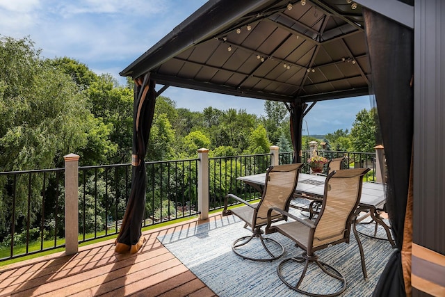 2040 Fountain Ln, Waconia, MN 55387 - wooden terrace with a gazebo and outdoor dining area