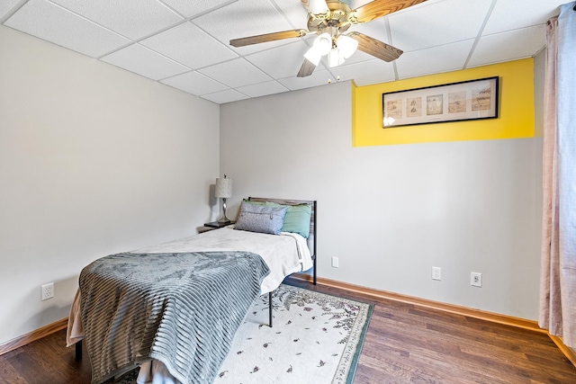 2040 Fountain Ln, Waconia, MN 55387 - bedroom featuring a drop ceiling, wood finished floors, and a ceiling fan