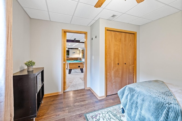 2040 Fountain Ln, Waconia, MN 55387 - bedroom featuring wood finished floors, a drop ceiling, billiards table, a closet, and a ceiling fan
