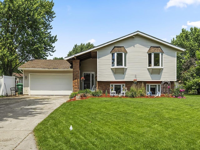 10740 99th Pl N, Maple Grove, MN 55369 - split level home featuring driveway, an attached garage, a front lawn, and brick siding