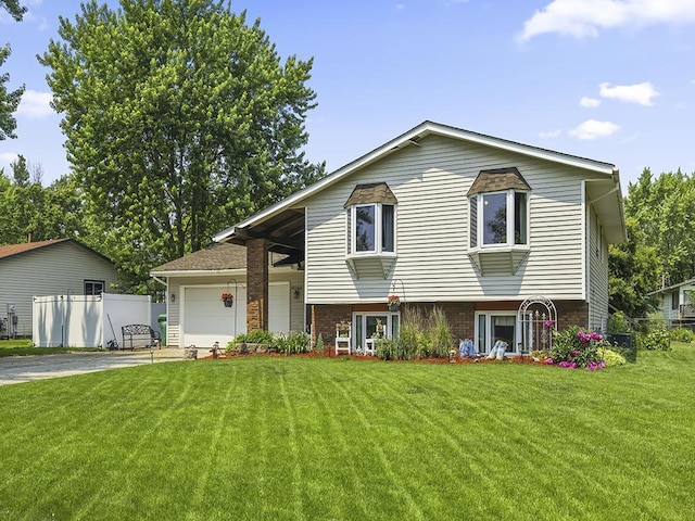 10740 99th Pl N, Maple Grove, MN 55369 - split level home featuring concrete driveway, brick siding, and an attached garage