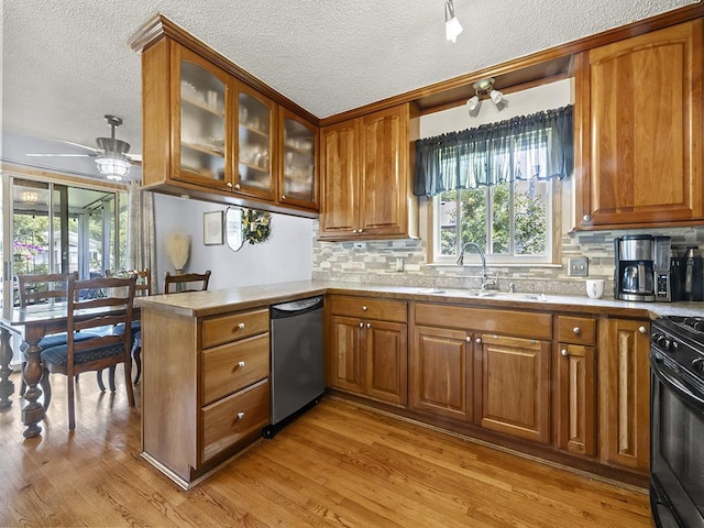 10740 99th Pl N, Maple Grove, MN 55369 - kitchen featuring dishwasher, brown cabinetry, light wood finished floors, tasteful backsplash, and a textured ceiling