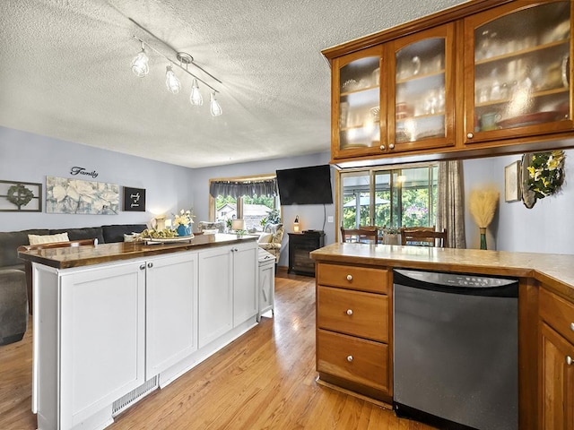 10740 99th Pl N, Maple Grove, MN 55369 - kitchen with dishwasher, open floor plan, light wood-style flooring, a textured ceiling, and glass insert cabinets