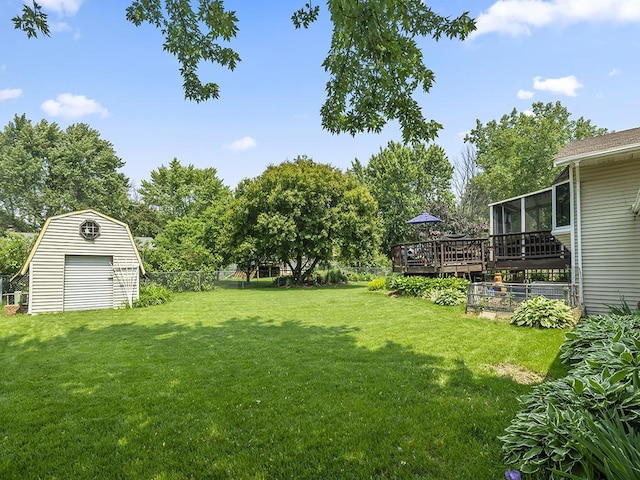 10740 99th Pl N, Maple Grove, MN 55369 - view of yard featuring a wooden deck, a shed, and a sunroom