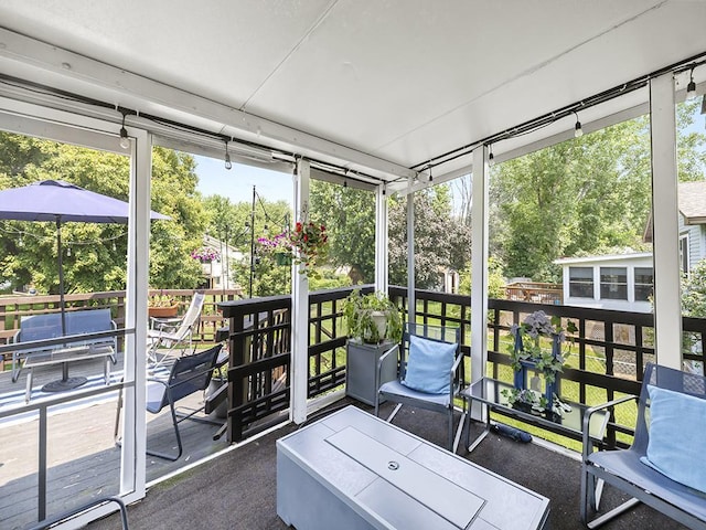 10740 99th Pl N, Maple Grove, MN 55369 - sunroom / solarium featuring healthy amount of natural light and view of wooded area