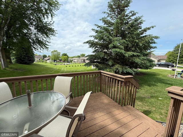 1508 Terrance Cir NE, New Prague, MN 56071 - wooden deck with outdoor dining area and a lawn