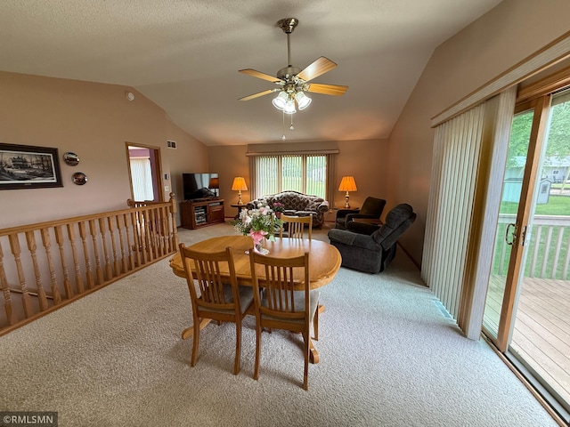 1508 Terrance Cir NE, New Prague, MN 56071 - dining area with vaulted ceiling, carpet floors, healthy amount of natural light, and a ceiling fan