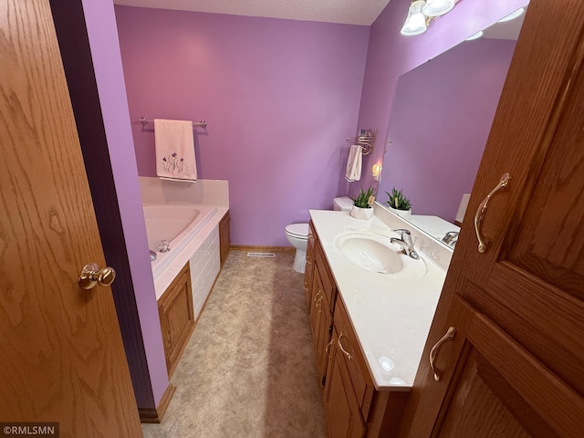 1508 Terrance Cir NE, New Prague, MN 56071 - bathroom featuring vanity, a garden tub, toilet, and baseboards