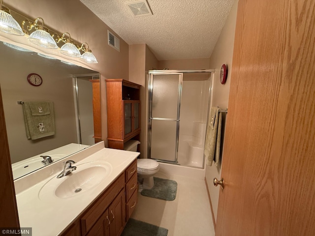 1508 Terrance Cir NE, New Prague, MN 56071 - bathroom with a textured ceiling, vanity, and toilet
