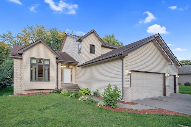 6626 Red Birch Ct, Lino Lakes, MN 55014 - view of front of home with an attached garage, concrete driveway, a front lawn, and brick siding