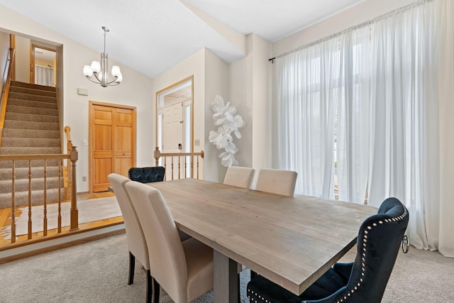 6626 Red Birch Ct, Lino Lakes, MN 55014 - dining room featuring carpet flooring, healthy amount of natural light, a chandelier, stairway, and lofted ceiling