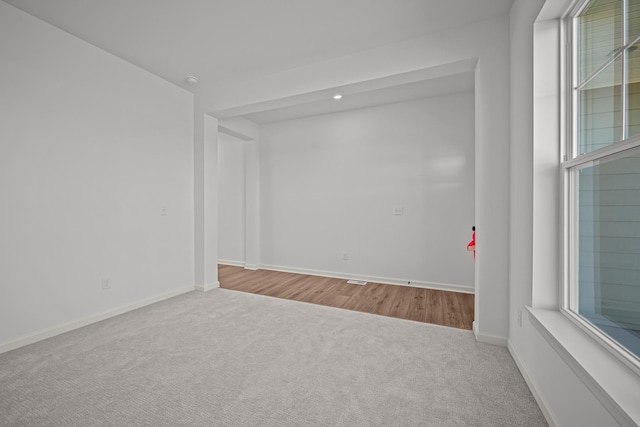 7150 Large Ave NE, Otsego, MN 55301 - spare room featuring carpet, baseboards, healthy amount of natural light, and recessed lighting