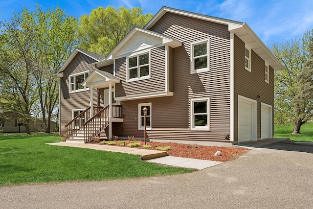 8415 Needham Ave NE, Otsego, MN 55330 - view of front of house with asphalt driveway, an attached garage, and a front lawn