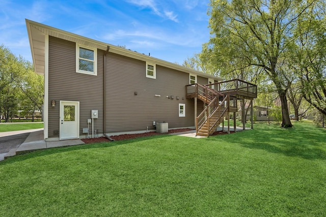 8415 Needham Ave NE, Otsego, MN 55330 - rear view of house featuring stairs, a deck, a lawn, and central AC