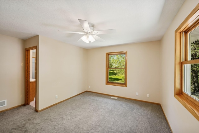8415 Needham Ave NE, Otsego, MN 55330 - spare room featuring carpet, a ceiling fan, and baseboards