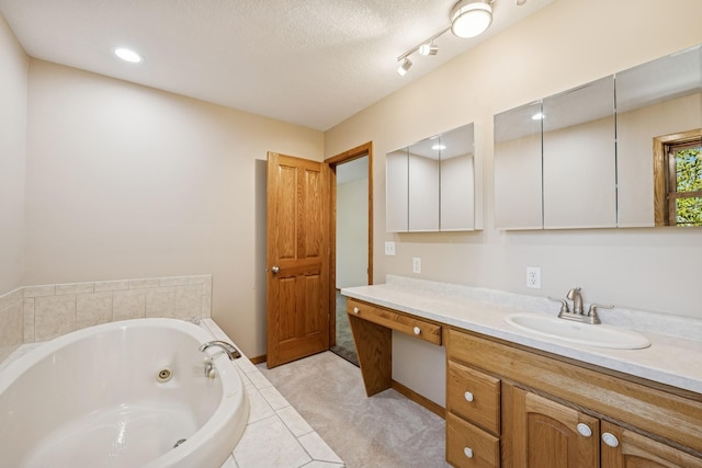 8415 Needham Ave NE, Otsego, MN 55330 - full bath with vanity, a whirlpool tub, a textured ceiling, and recessed lighting