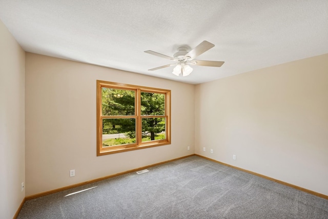 8415 Needham Ave NE, Otsego, MN 55330 - spare room with carpet flooring, baseboards, and ceiling fan
