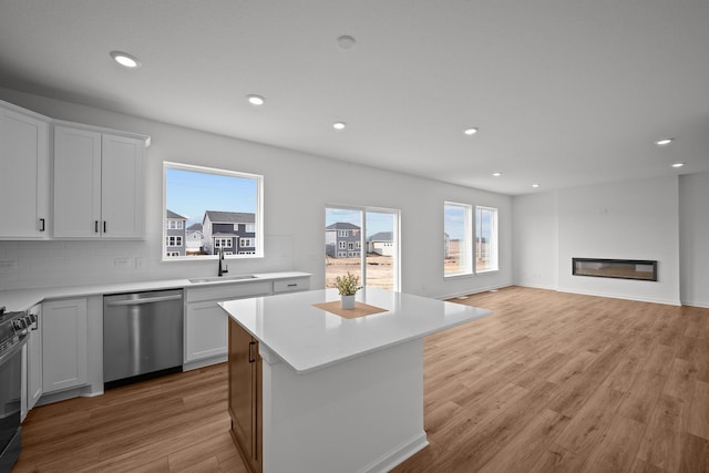 7130 Large Ave NE, Otsego, MN 55301 - kitchen with dishwasher, a sink, recessed lighting, a center island, and backsplash