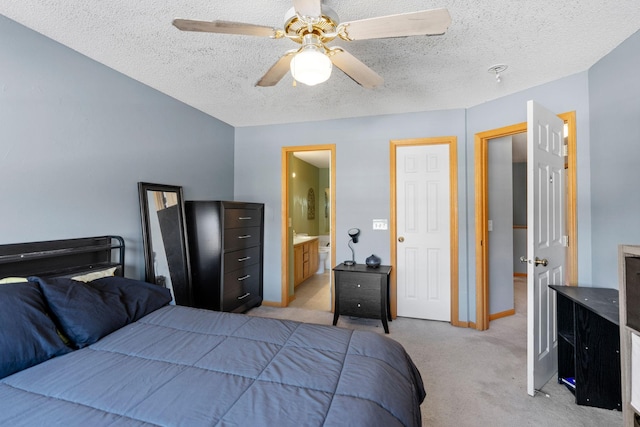20616 Erin Way Unit 74, Farmington, MN 55024 - bedroom featuring light colored carpet, a textured ceiling, connected bathroom, and a ceiling fan