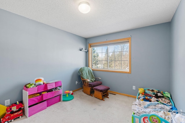 20616 Erin Way Unit 74, Farmington, MN 55024 - recreation room featuring carpet flooring, a textured ceiling, and baseboards