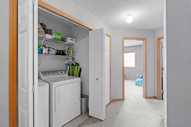 20616 Erin Way Unit 74, Farmington, MN 55024 - laundry area with independent washer and dryer, a textured ceiling, baseboards, and light colored carpet