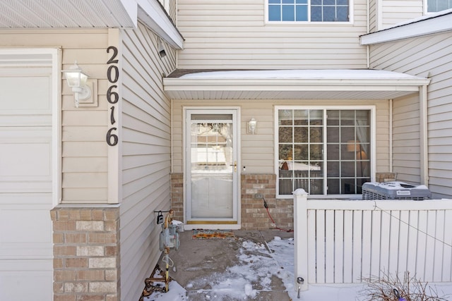 20616 Erin Way Unit 74, Farmington, MN 55024 - snow covered property entrance with radiator heating unit