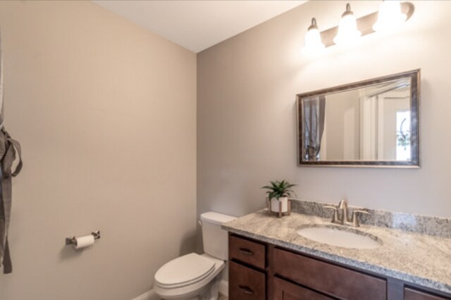 642 Haeberle Ave, New Ulm, MN 56073 - half bathroom featuring toilet and vanity