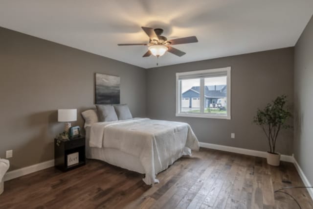 642 Haeberle Ave, New Ulm, MN 56073 - bedroom with dark wood-type flooring and a ceiling fan