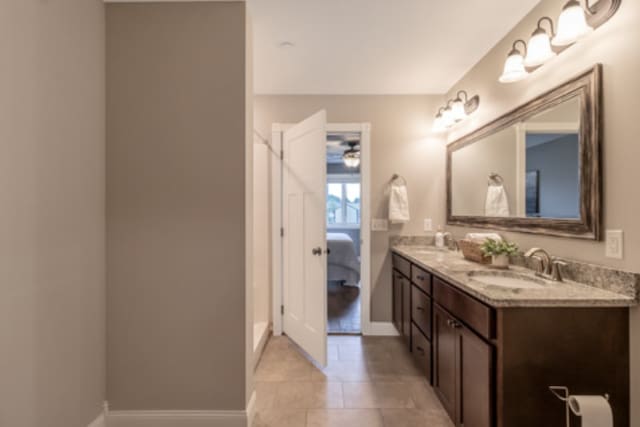 642 Haeberle Ave, New Ulm, MN 56073 - bathroom featuring double vanity, ensuite bathroom, and tile patterned flooring