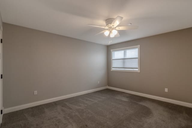 642 Haeberle Ave, New Ulm, MN 56073 - unfurnished room featuring a ceiling fan and dark colored carpet
