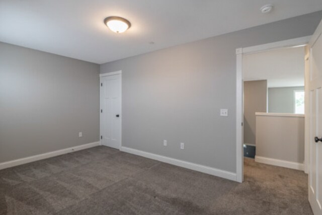 642 Haeberle Ave, New Ulm, MN 56073 - spare room with carpet floors and a smoke detector