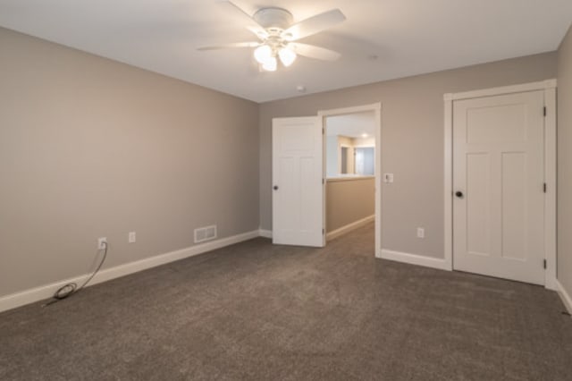 642 Haeberle Ave, New Ulm, MN 56073 - unfurnished bedroom featuring dark colored carpet and ceiling fan