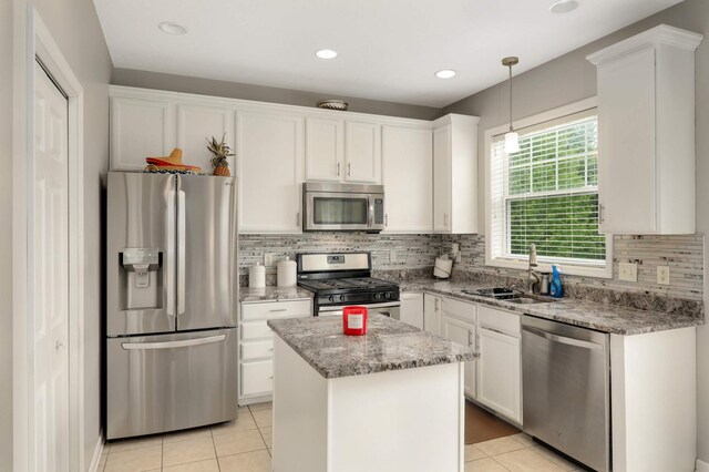 12049 Waconia Cir NE, Blaine, MN 55449 - kitchen with stainless steel appliances, a sink, white cabinets, and recessed lighting