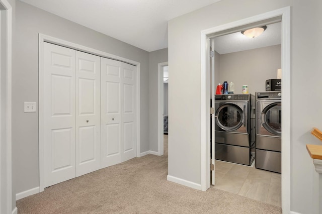 12049 Waconia Cir NE, Blaine, MN 55449 - washroom featuring washing machine and clothes dryer, light carpet, and baseboards