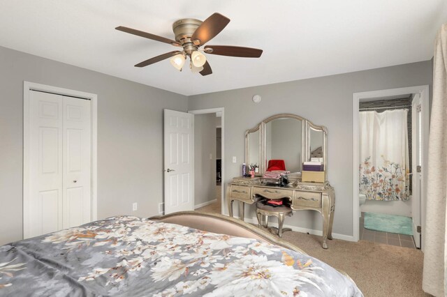 12049 Waconia Cir NE, Blaine, MN 55449 - bedroom featuring a closet, carpet flooring, baseboards, ceiling fan, and ensuite bath