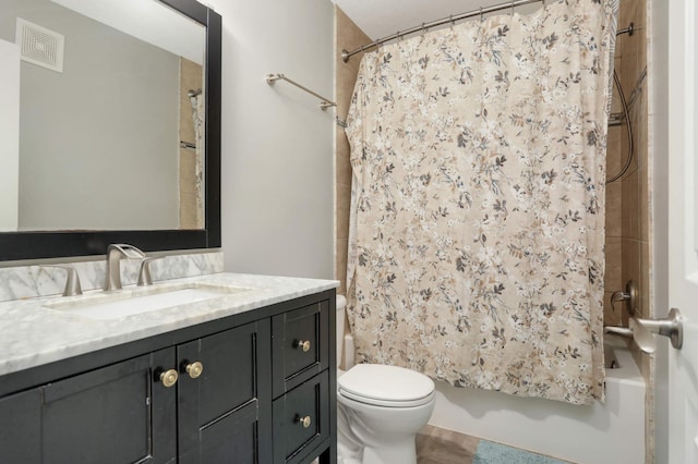 12049 Waconia Cir NE, Blaine, MN 55449 - full bathroom featuring vanity, shower / tub combo, and toilet