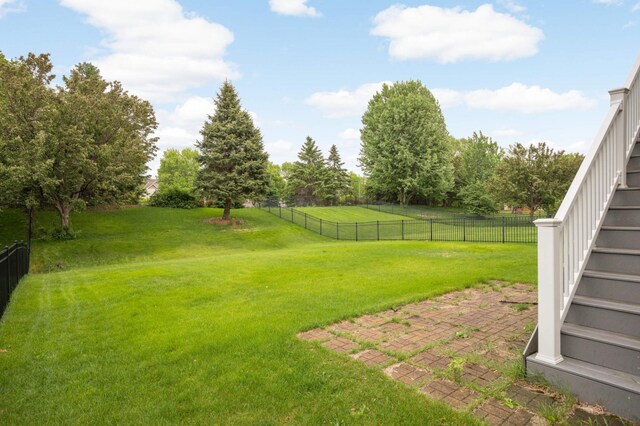 12049 Waconia Cir NE, Blaine, MN 55449 - view of yard with stairway and a patio