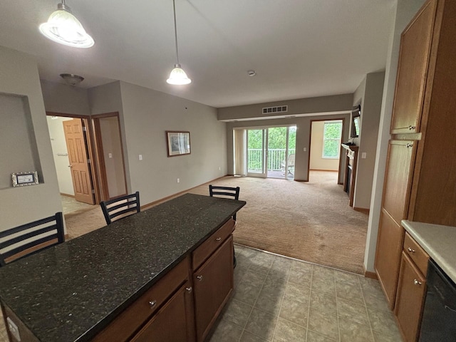 601 Levander Way Unit 311, South Saint Paul, MN 55075 - kitchen with carpet, black dishwasher, decorative light fixtures, open floor plan, and a center island