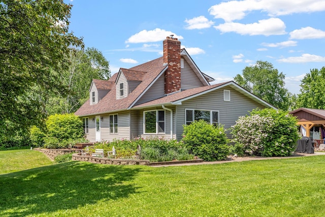 11520 120th St N, Stillwater, MN 55082 - back of property featuring a yard, a shingled roof, and a chimney