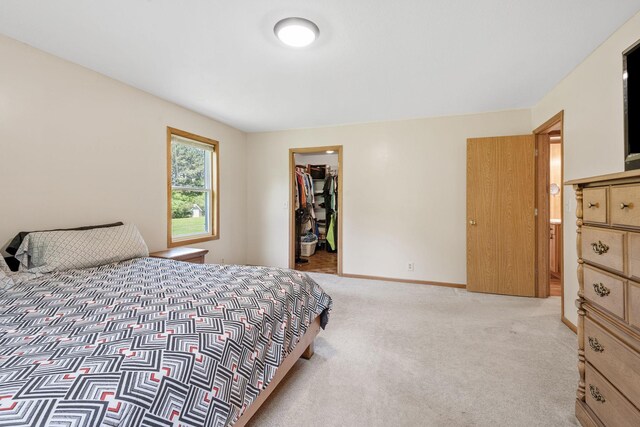 11520 120th St N, Stillwater, MN 55082 - bedroom with light carpet, a spacious closet, baseboards, and a closet
