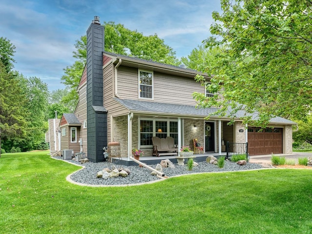 1144 Waldon Pl, Arden Hills, MN 55112 - view of front of home with a chimney, a front lawn, an attached garage, central AC unit, and covered porch