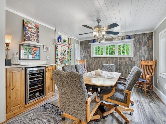 1144 Waldon Pl, Arden Hills, MN 55112 - dining area with wine cooler, ornamental molding, light wood-style floors, a ceiling fan, and wooden ceiling