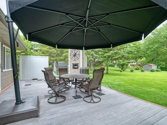 1144 Waldon Pl, Arden Hills, MN 55112 - wooden deck featuring outdoor dining space and a lawn