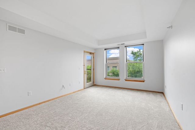 560 2nd St Unit 408, Minneapolis, MN 55401 - carpeted spare room featuring a raised ceiling and baseboards