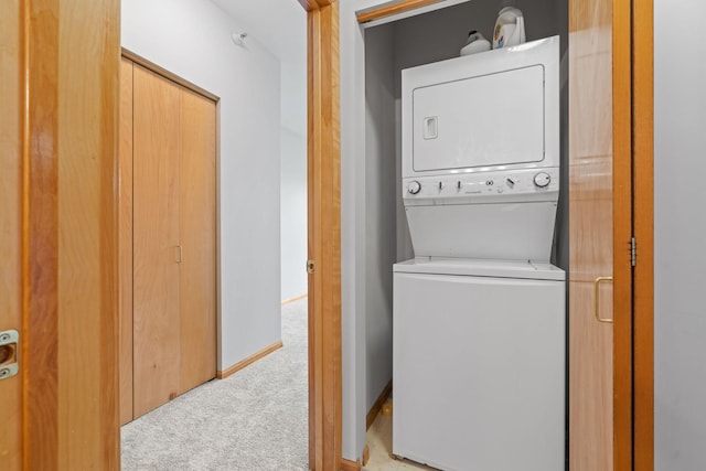 560 2nd St Unit 408, Minneapolis, MN 55401 - laundry room with stacked washer and clothes dryer and carpet flooring