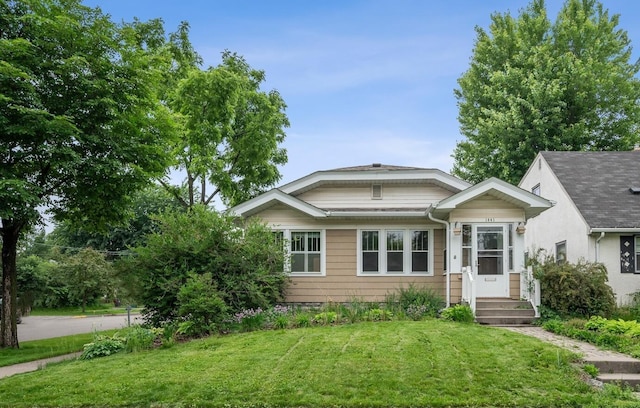 1441 Simpson St, Saint Paul, MN 55108 - bungalow featuring a front lawn