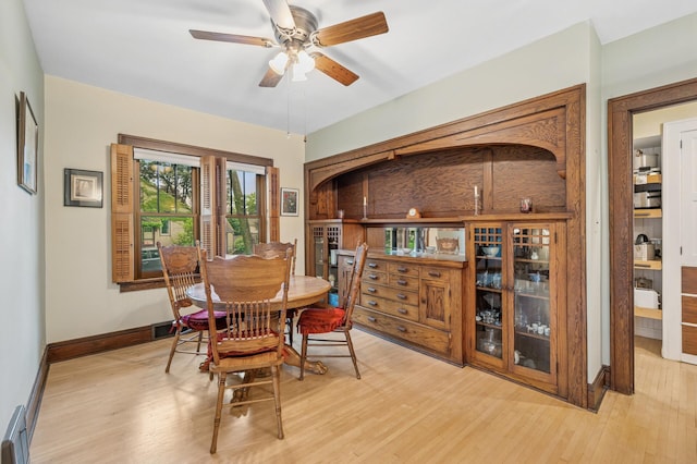 1441 Simpson St, Saint Paul, MN 55108 - dining room with light wood-type flooring, a ceiling fan, and a baseboard heating unit