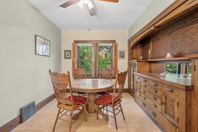 1441 Simpson St, Saint Paul, MN 55108 - dining room with light wood-style floors and a ceiling fan