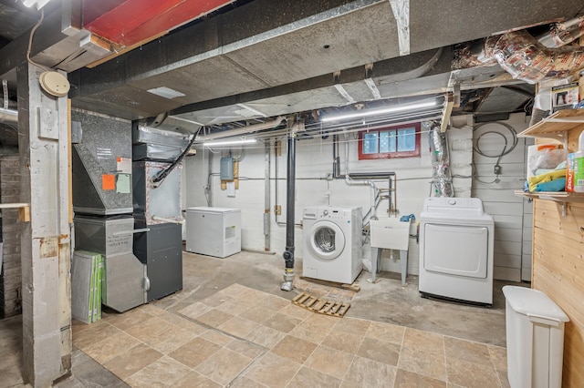1441 Simpson St, Saint Paul, MN 55108 - below grade area with washing machine and dryer, heating unit, and fridge