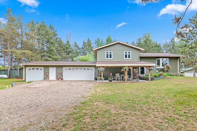 4480 253rd Ave NW, Isanti, MN 55040 - tri-level home with driveway, a garage, and stone siding